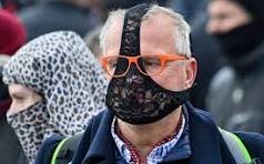 Best photo of the week: Underwear face mask at a German anti ...